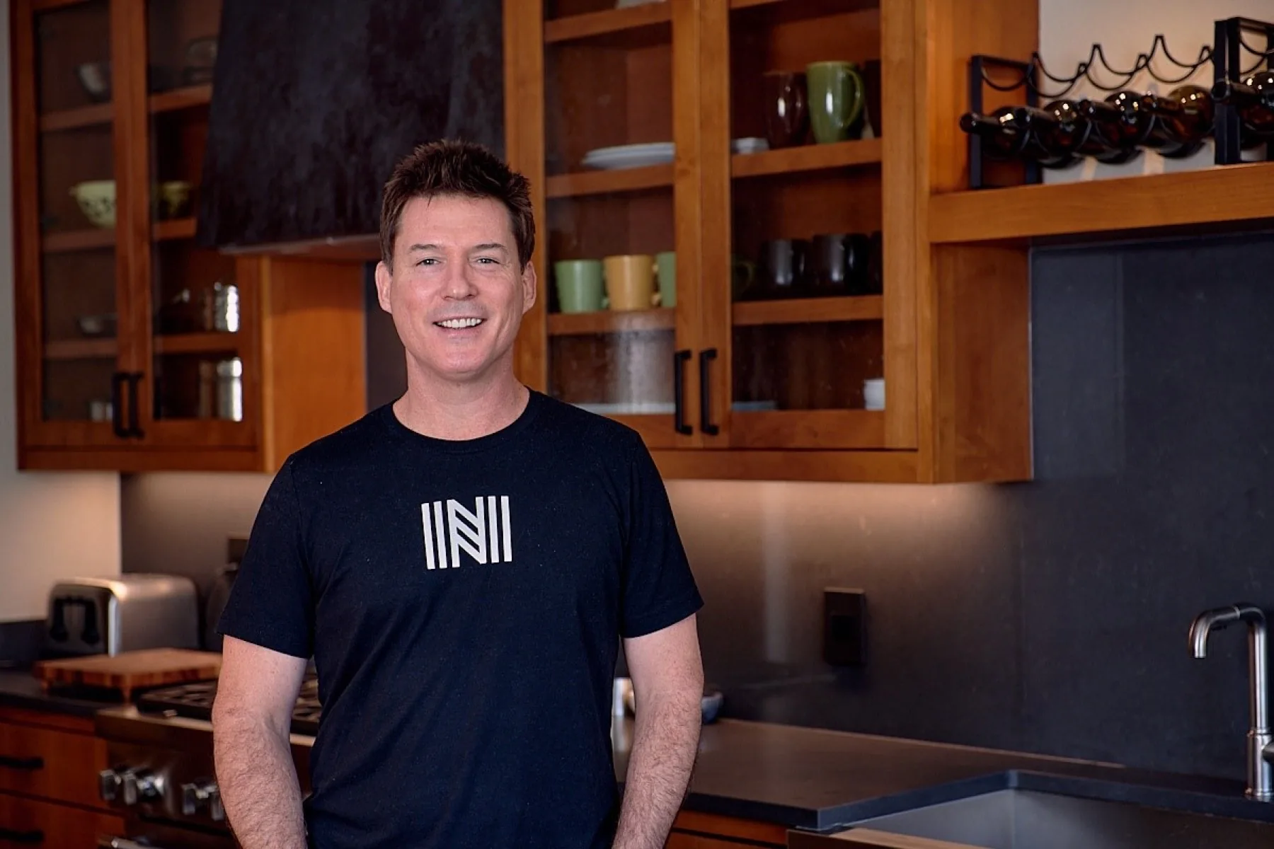 Roy Faust, owner and lead designer of New Creations, in a remodeled Austin kitchen